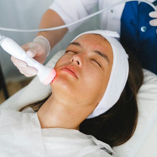 woman at med spa receiving infrared light treatment for anti-aginng