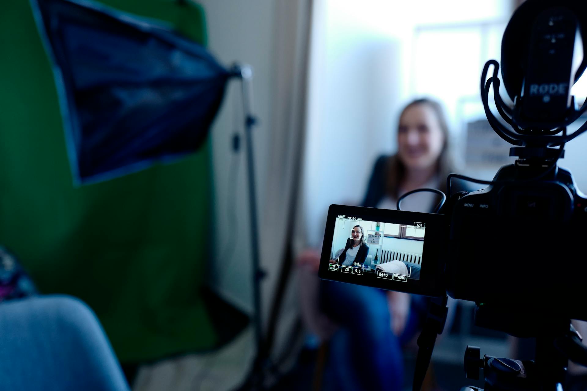 Woman by green screen video