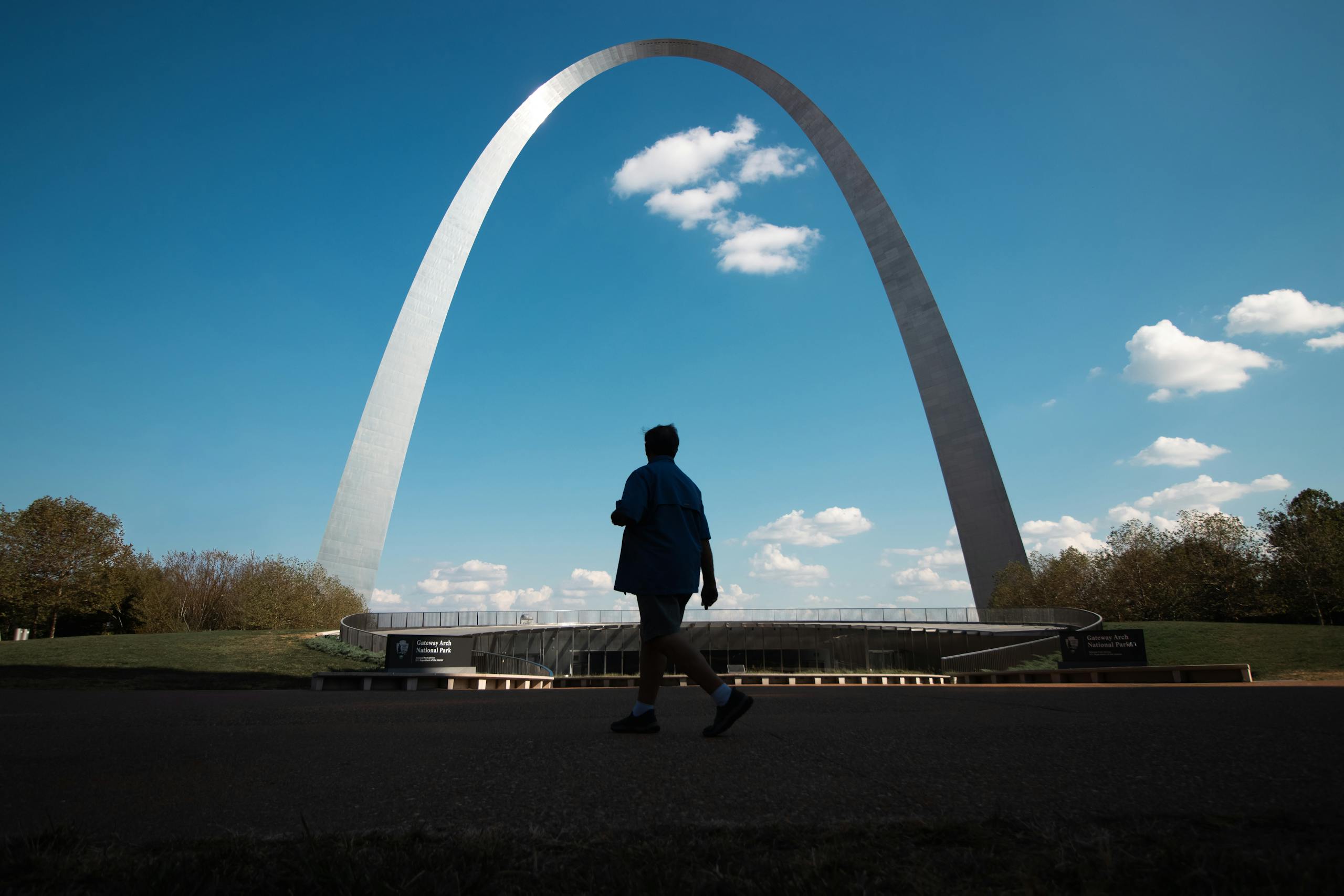 St. Louis Arch and pedestrian in shadow